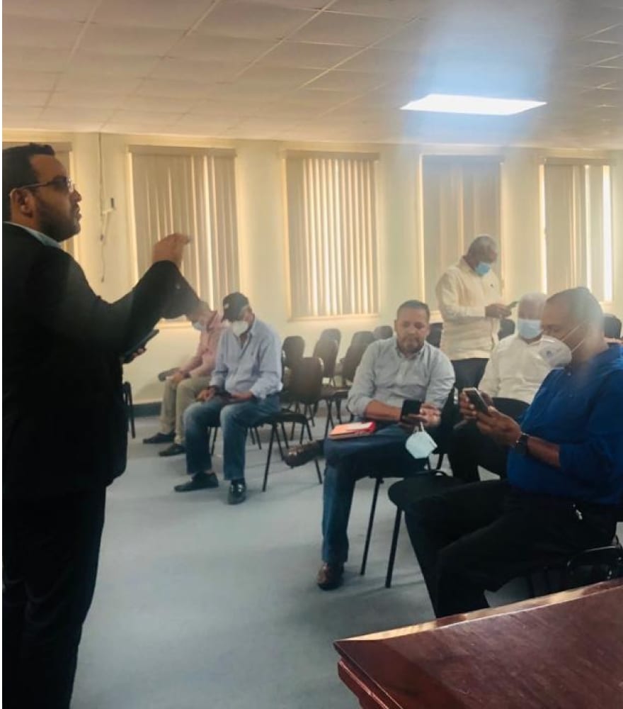 Fran Bencosme running a testing session with police officers in a station meeting room