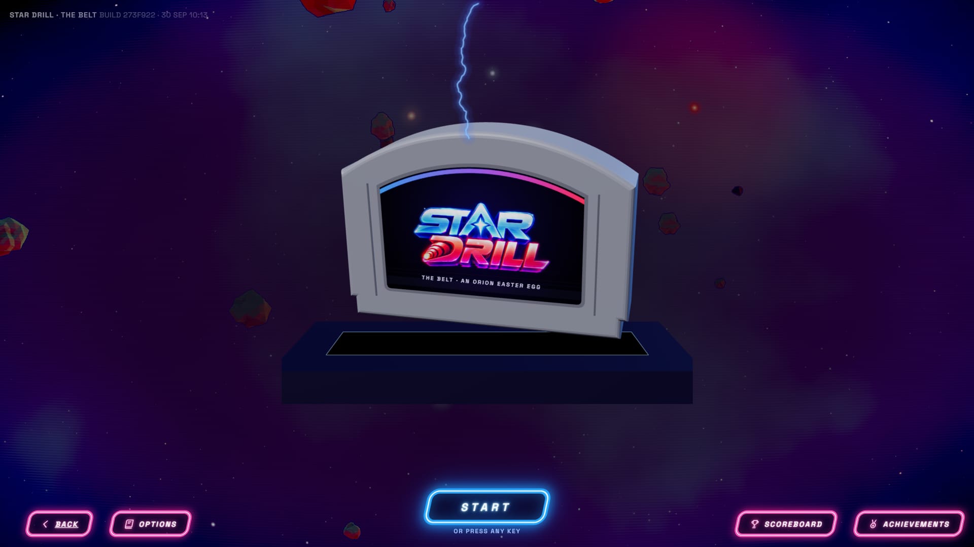 The Star Drill title screen: an N64-shaped cartridge standing on a table, labelled STAR DRILL, THE BELT, AN ORION EASTER EGG